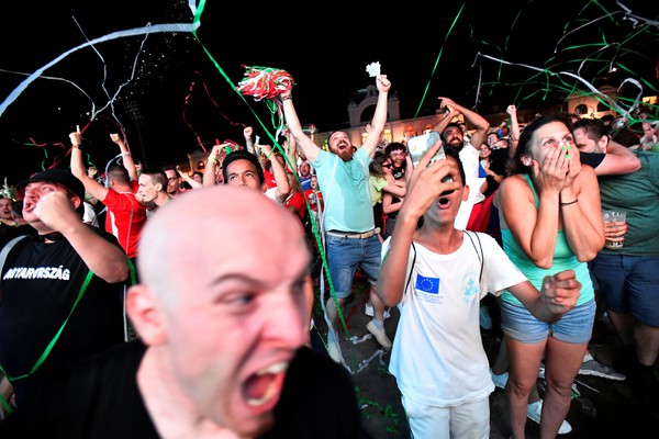 Soccer Football - Euro 2020 - Fans gather for Germany v Hungary - Budapest, Hungary - June 23, 2021 Hungary fans celebrate as they watch the match in Budapest REUTERS/Marton Monus     TPX IMAGES OF THE DAY