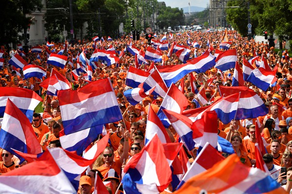 Soccer Football - Euro 2020 - Fans gather for Netherlands v Czech Republic - Budapest, Hungary - June 27, 2021 Netherlands fans with flags in a fanzone before the match REUTERS/Marton Monus     TPX IMAGES OF THE DAY