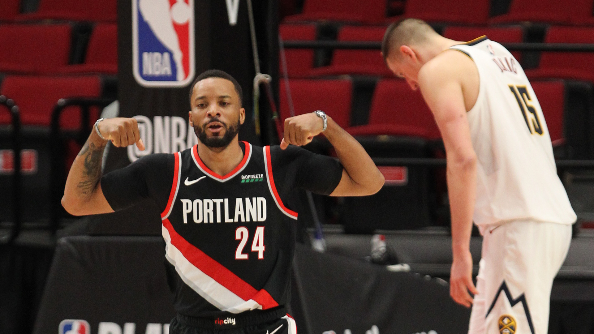 May 29, 2021; Portland, Oregon, USA; Portland Trail Blazers forward Norman Powell (24) reacts after scoring over Denver Nuggets center Nikola Jokic (15) in the second half during game four in the first round of the 2021 NBA Playoffs. at Moda Center. Mandatory Credit: Jaime Valdez-USA TODAY Sports